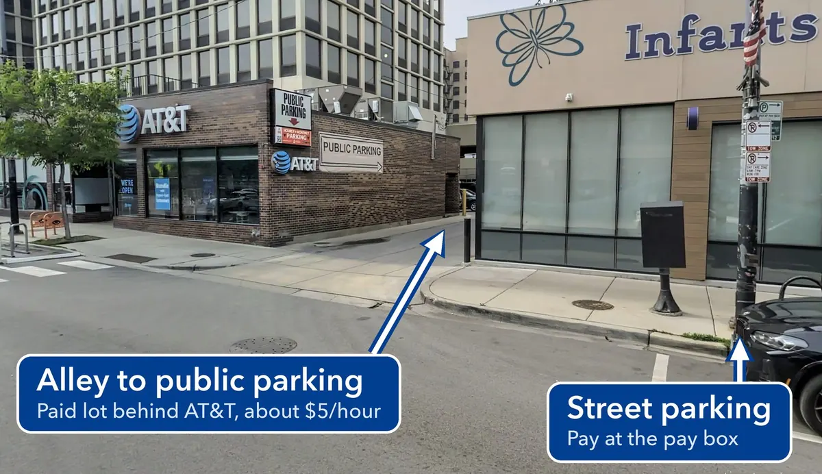 The alley between the AT&T store and the daycare, labeled as the way into the public parking lot, with street parking at the curb